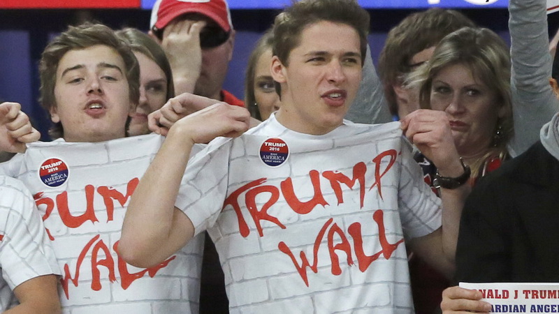 FILE - In this Saturday, April 2, 2016 file photo, supporters of Republican presidential candidate Donald Trump chant, "Build that wall," before a town hall meeting in Rothschild, Wis. (AP Photo/Charles Rex Arbogast, File)