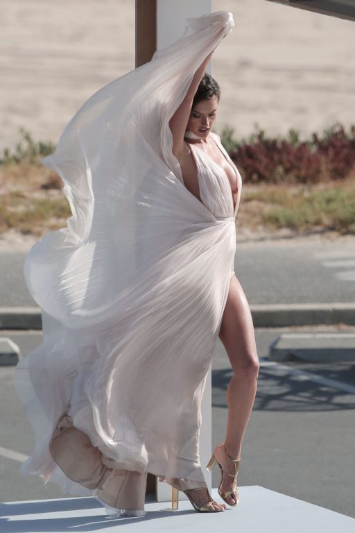 Alessandra Ambrosia experiences several wardrobe malfunctions during a secret photo shoot on the beach