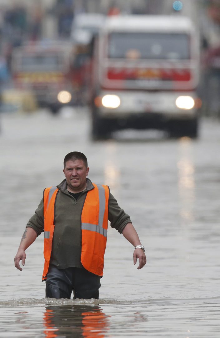 A city worker walks through a flooded area during a massive rescue operation after heavy rainfall in Nemours, southern Paris, June 1, 2016. REUTERS/Christian Hartmann