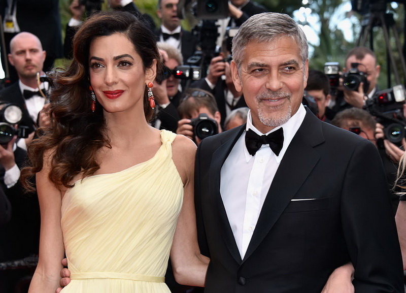 CANNES, FRANCE - MAY 12:  Lawyer Amal Clooney (L) and actor George Clooney attend a screening of "Money Monster" at the annual 69th Cannes Film Festival at Palais des Festivals on May 12, 2016 in Cannes, France.  (Photo by Pascal Le Segretain/Getty Images)
